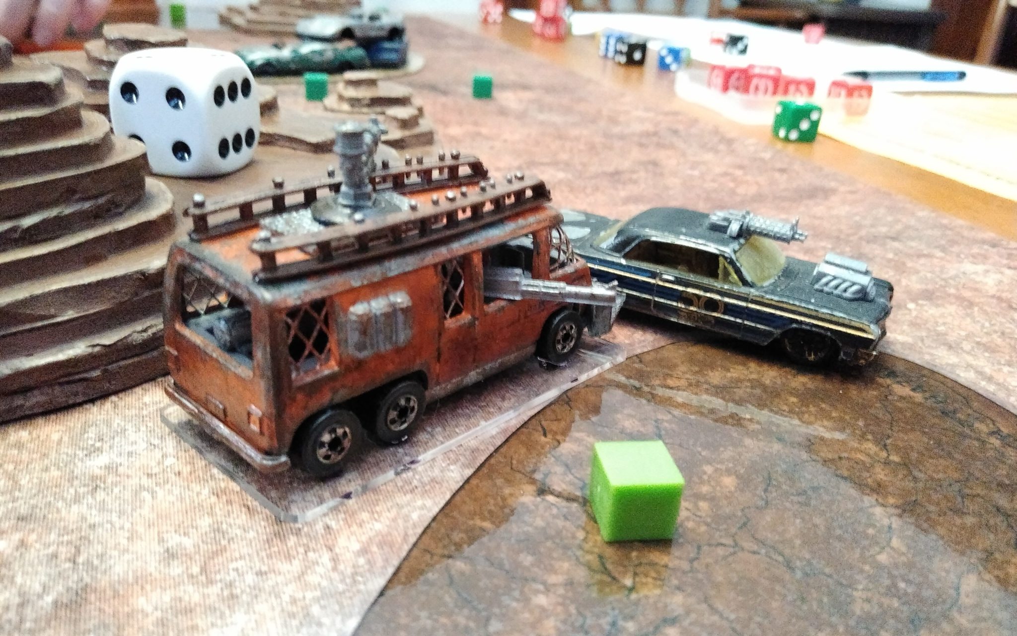 A Matchbox sized VW Bus crashing into another armored car